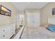 A neutral bedroom with a flat-screen TV, a closet, an ensuite bathroom and natural light from a window at 556 Timber Creek Dr., Loris, SC 29569