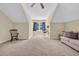 Bonus room featuring plush carpet, neutral walls, a ceiling fan, and a window for natural light at 556 Timber Creek Dr., Loris, SC 29569