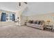 A cozy bonus room with neutral walls, plush carpet, a ceiling fan, and natural light from a window at 556 Timber Creek Dr., Loris, SC 29569