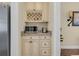 Convenient butler pantry with custom cabinetry, granite countertop, and built-in microwave at 556 Timber Creek Dr., Loris, SC 29569