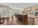 Open kitchen and dining area with hardwood floors, granite island, and stainless appliances at 556 Timber Creek Dr., Loris, SC 29569