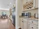 Well-lit kitchen featuring stainless steel appliances, granite counters, and stylish cabinetry with a wine rack at 556 Timber Creek Dr., Loris, SC 29569