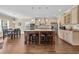 Open kitchen and dining area featuring a large island with seating and stainless steel appliances at 556 Timber Creek Dr., Loris, SC 29569