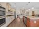 Spacious kitchen featuring granite countertops, stainless steel appliances, and hardwood floors at 556 Timber Creek Dr., Loris, SC 29569