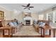 Cozy living room with a fireplace, comfortable sofas, and abundant natural light at 556 Timber Creek Dr., Loris, SC 29569