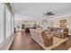 Open-concept living area featuring hardwood floors, a ceiling fan, and seamless flow into the kitchen at 556 Timber Creek Dr., Loris, SC 29569