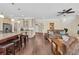 Open-concept living space with kitchen island, hardwood floors, and comfortable seating area at 556 Timber Creek Dr., Loris, SC 29569