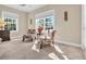 Bright sitting area with windows, comfortable chairs, and a serene view of the outdoors at 556 Timber Creek Dr., Loris, SC 29569