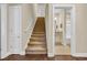 Carpeted stairs lead to the second floor with view into a bathroom at 556 Timber Creek Dr., Loris, SC 29569