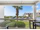 Balcony view showcasing lush greenery and a parking area, offering a glimpse of the outdoor surroundings at 5601 N Ocean Blvd. # E-111, Myrtle Beach, SC 29577