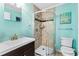 Bright bathroom with a curved glass shower and modern vanity at 5601 N Ocean Blvd. # E-111, Myrtle Beach, SC 29577
