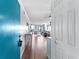 Bright entryway featuring hardwood floors, a coastal color palette, and a glimpse into the cozy living area at 5601 N Ocean Blvd. # E-111, Myrtle Beach, SC 29577
