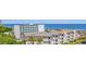 A condominium with a view of the ocean and professionally maintained landscaping at 5601 N Ocean Blvd. # E-111, Myrtle Beach, SC 29577