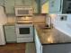 The kitchen has updated appliances, hardwood floors, and painted cabinets at 5601 N Ocean Blvd. # E-111, Myrtle Beach, SC 29577