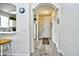 Hallway view leading from dining area to the front door and kitchen with plank flooring at 5750 Oyster Catcher Dr. # 1034, North Myrtle Beach, SC 29582