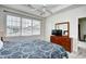 Bedroom with a window, ceiling fan, dresser and TV at 5750 Oyster Catcher Dr. # 1034, North Myrtle Beach, SC 29582