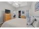 Comfortable bedroom with tray ceiling, ceiling fan, closet and bright lighting at 601 Hillside Dr. # 4233, North Myrtle Beach, SC 29582