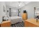 Bedroom with wood floors, ceiling fan, and bright natural light at 601 Hillside Dr. # 4233, North Myrtle Beach, SC 29582