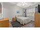 Cozy bedroom with tray ceiling, ceiling fan, wood floors and comfortable queen size bed at 601 Hillside Dr. # 4233, North Myrtle Beach, SC 29582