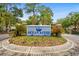 Entrance to the community featuring a landscaped sign and brick paved entrance at 601 Hillside Dr. # 4233, North Myrtle Beach, SC 29582