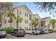 Beautiful condo complex showcasing multiple levels, white balconies, and lush green trees at 601 Hillside Dr. # 4233, North Myrtle Beach, SC 29582
