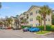 View of the condo complex showcasing well-maintained landscaping and ample parking at 601 Hillside Dr. # 4233, North Myrtle Beach, SC 29582