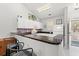 Bright kitchen with white cabinetry, black countertops, and bar seating area at 601 Hillside Dr. # 4233, North Myrtle Beach, SC 29582