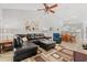 Comfortable living room showcasing a plush sofa, accent chair, dining area, and open concept layout at 601 Hillside Dr. # 4233, North Myrtle Beach, SC 29582