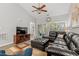 Cozy living room featuring a sectional sofa, entertainment center, and sliding door access to a balcony at 601 Hillside Dr. # 4233, North Myrtle Beach, SC 29582