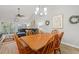 Open-concept living area with a dining table and chairs, seamlessly connecting to the comfortable living room at 601 Hillside Dr. # 4233, North Myrtle Beach, SC 29582