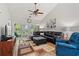 A spacious living room with a plush leather sectional, accent chair, and sliding glass doors to the balcony at 601 Hillside Dr. # 4233, North Myrtle Beach, SC 29582