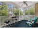 Relaxing screened porch with seating and a table, offering a peaceful outdoor space at 601 Hillside Dr. # 4233, North Myrtle Beach, SC 29582