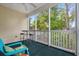 Serene screened-in porch featuring seating and a table, perfect for enjoying the outdoor scenery at 601 Hillside Dr. # 4233, North Myrtle Beach, SC 29582