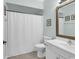Bathroom featuring a single vanity, commode, framed mirror, and shower with white curtain at 601 Hillside Dr. N # 3031, North Myrtle Beach, SC 29582