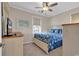 Cozy bedroom with stylish furnishings, blue floral bedding, and a ceiling fan at 601 Hillside Dr. N # 3031, North Myrtle Beach, SC 29582