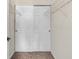 Walk-in closet featuring a door, shelving, neutral walls, and neutral carpet at 601 Hillside Dr. N # 3031, North Myrtle Beach, SC 29582