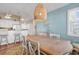 Bright dining area featuring a wooden table, natural light, and coastal-inspired decor at 601 Hillside Dr. N # 3031, North Myrtle Beach, SC 29582