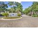 A beautifully landscaped entrance to Ocean Keyes community, with a brick-paved driveway and lush greenery at 601 Hillside Dr. N # 3031, North Myrtle Beach, SC 29582