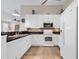Modern kitchen features white appliances, granite countertops, tile backsplash, and tile flooring at 601 Hillside Dr. N # 3031, North Myrtle Beach, SC 29582