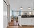 Bright open kitchen flowing into dining area with wood floors and modern finishes at 601 Hillside Dr. N # 3031, North Myrtle Beach, SC 29582
