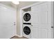 Laundry closet boasts a stacked washer and dryer and double doors for easy access and storage at 601 Hillside Dr. N # 3031, North Myrtle Beach, SC 29582