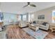 Open concept living room with hardwood floors, natural light, and dining area at 601 Hillside Dr. N # 3031, North Myrtle Beach, SC 29582