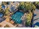 Aerial view of community tennis court surrounded by trees and other buildings at 601 Hillside Dr. N # 3031, North Myrtle Beach, SC 29582