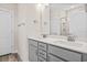Bright bathroom featuring a double sink vanity with gray cabinets and wood-look flooring at 619 Castle Ct., Myrtle Beach, SC 29579