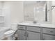 Neutral bathroom features a shower-tub, toilet, and light gray vanity with white countertop at 619 Castle Ct., Myrtle Beach, SC 29579
