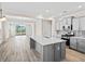 Well-designed kitchen with island, stainless steel appliances, and an open view to living area at 619 Castle Ct., Myrtle Beach, SC 29579