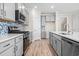 Stunning kitchen featuring stainless appliances, a kitchen island, and a stylish tile backsplash at 619 Castle Ct., Myrtle Beach, SC 29579