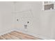 Bright laundry room with washer and dryer hookups, utility shelf, and light vinyl flooring at 619 Castle Ct., Myrtle Beach, SC 29579