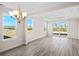 Bright living area featuring many windows overlooking the property's backyard at 619 Castle Ct., Myrtle Beach, SC 29579
