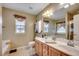 Bathroom with double sink vanity, large mirror, and separate tub and shower at 645 Twinflower St., Little River, SC 29566